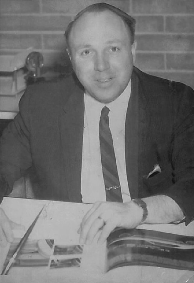 Bill Reineke Sr at his desk in the Fostoria showroom