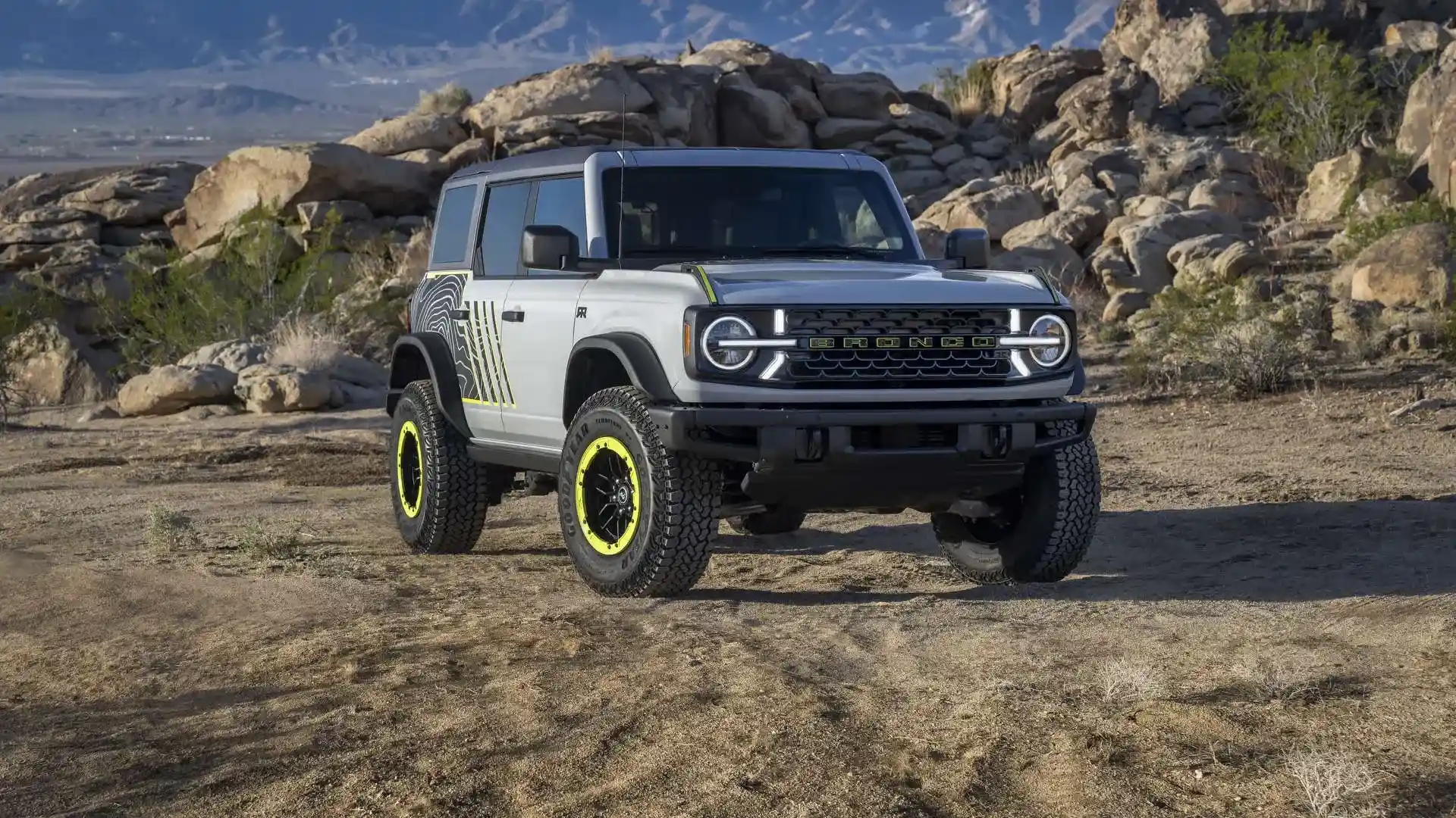 A Ford Bronco on open ground, one of the many vehicle types Reineke buys