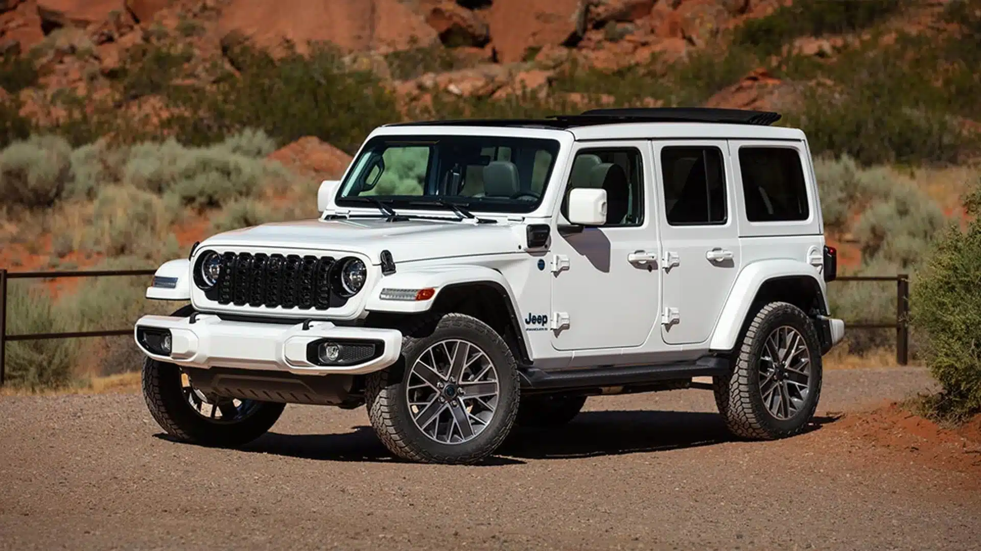 A Jeep Wrangler parked on open ground, one of the many vehicle types Reineke buys