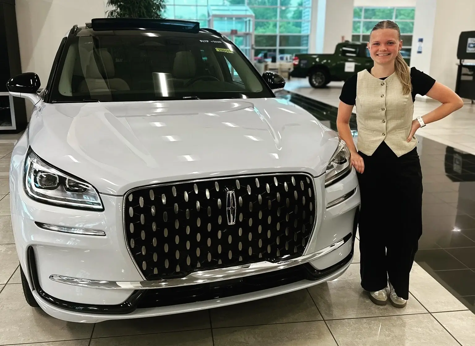The front of a white Lincoln Aviator with its new owner